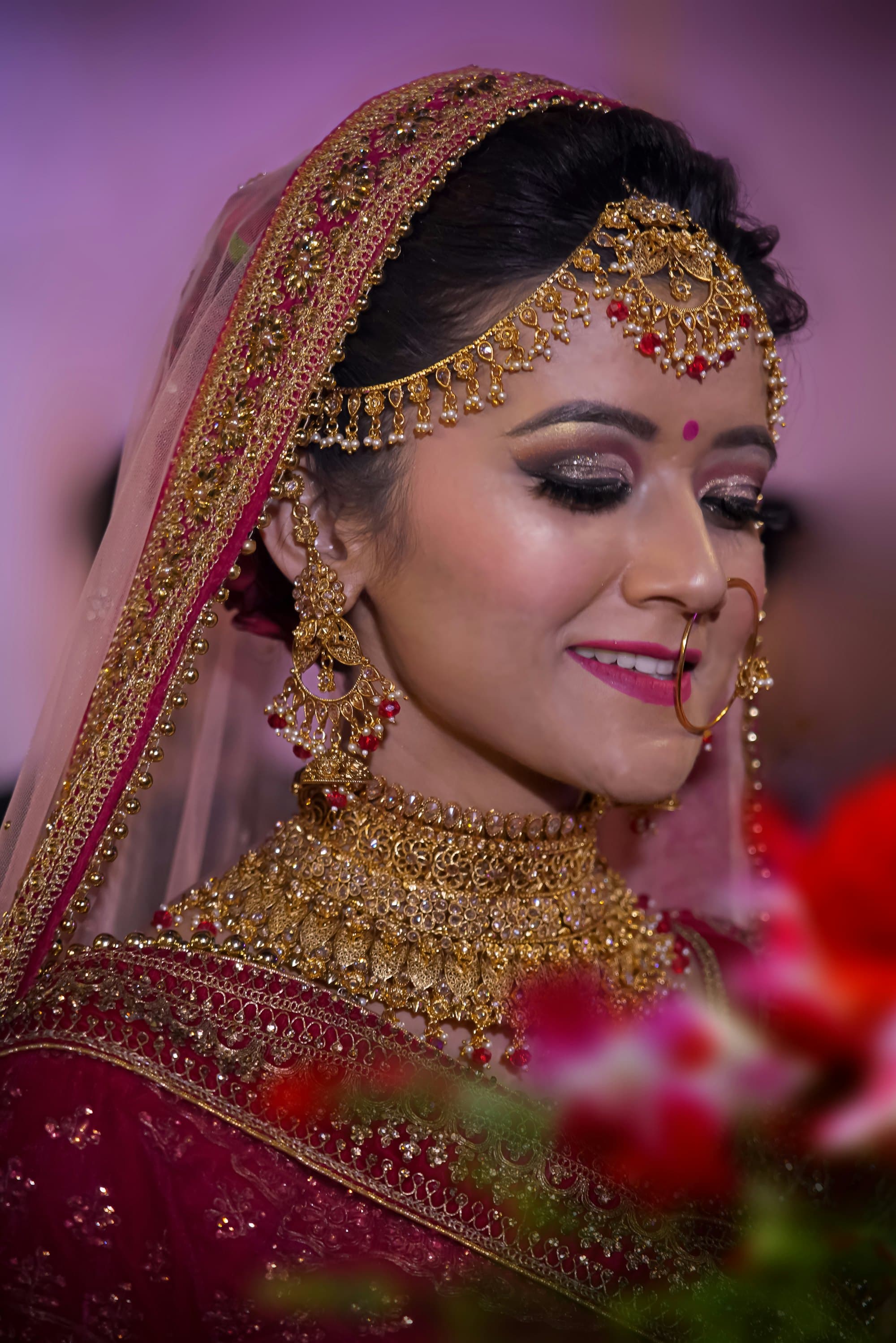 Bridal portrait in gold jewellery with a soft, luminous signature glam finish