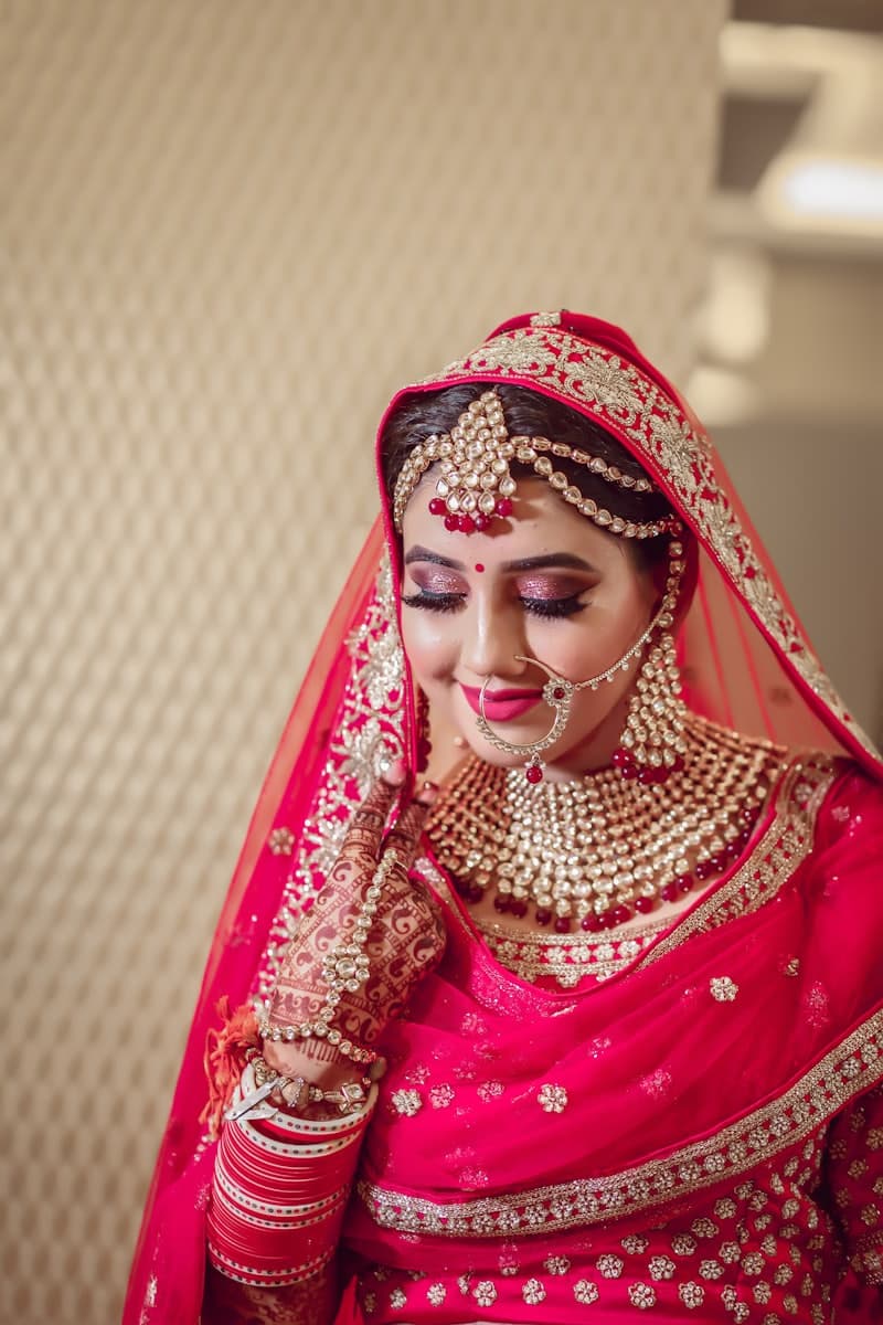 Bridal look in a red and gold hijab